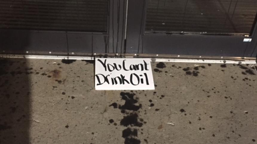 Sign left along with motor oil at North Dakota capitol grounds. Photo via Forum News Service